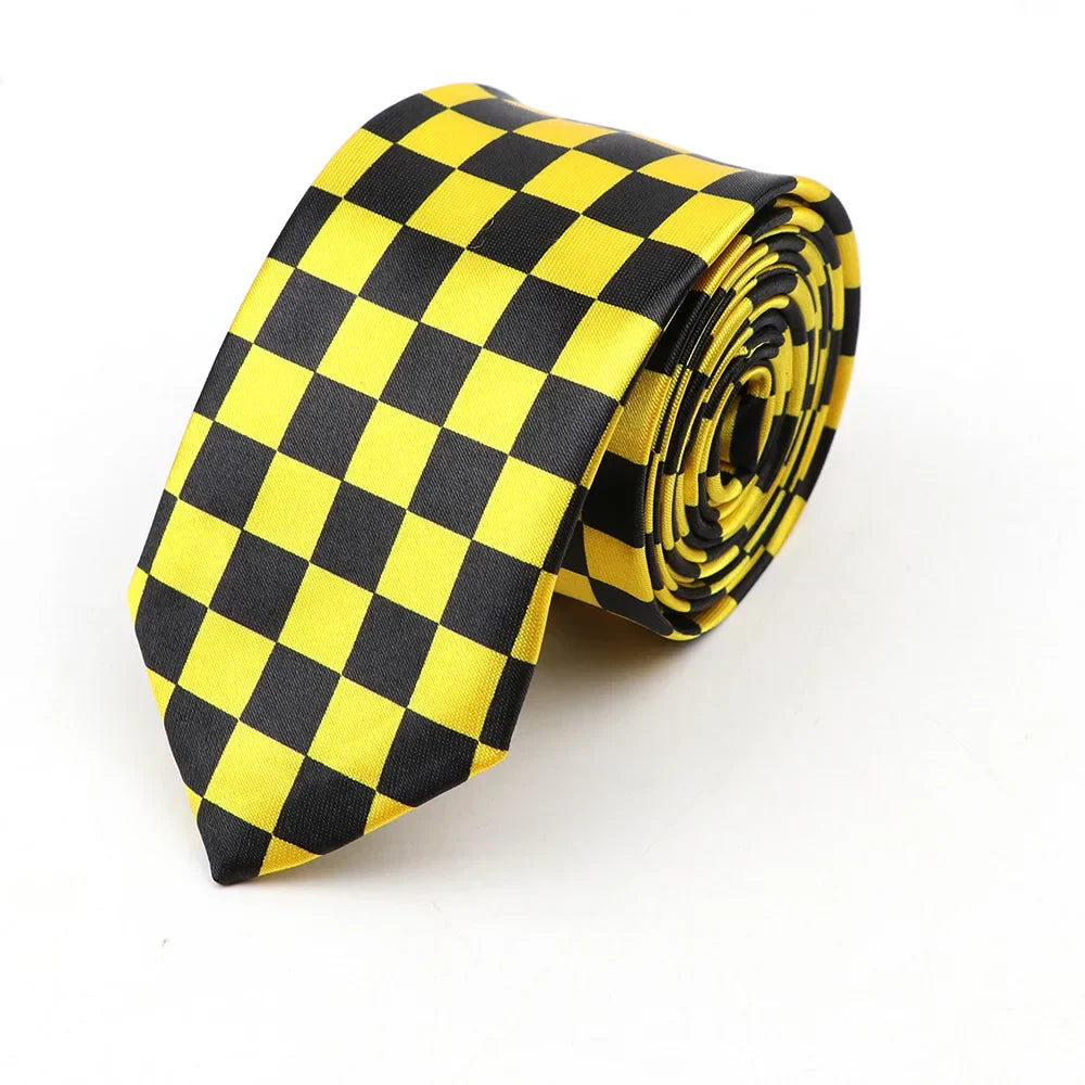 A sleek yellow and black checkered classic skinny tie made of printed piano polyester neatly rolled for display