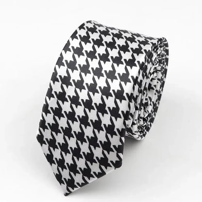 A sleek black and white houndstooth classic skinny tie made from smooth satin polyester perfect for formal occasions