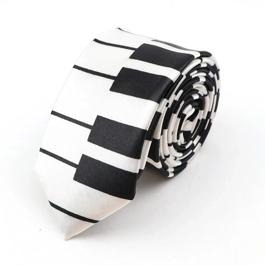 A sleek black and white printed piano polyester classic skinny tie with colorful musical notes neatly rolled for display