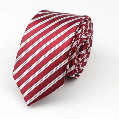 A neatly rolled burgundy classic skinny tie with crisp white stripes made of smooth printed piano polyester fabric