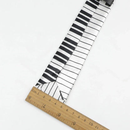 Men’s classic skinny tie with black and white printed piano polyester pattern featuring colorful musical notes design
