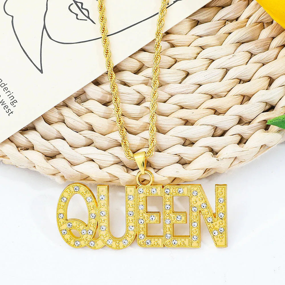 Gold-colored queen pendant necklace with sparkling rhinestones on a hip hop king cuban link chain for men