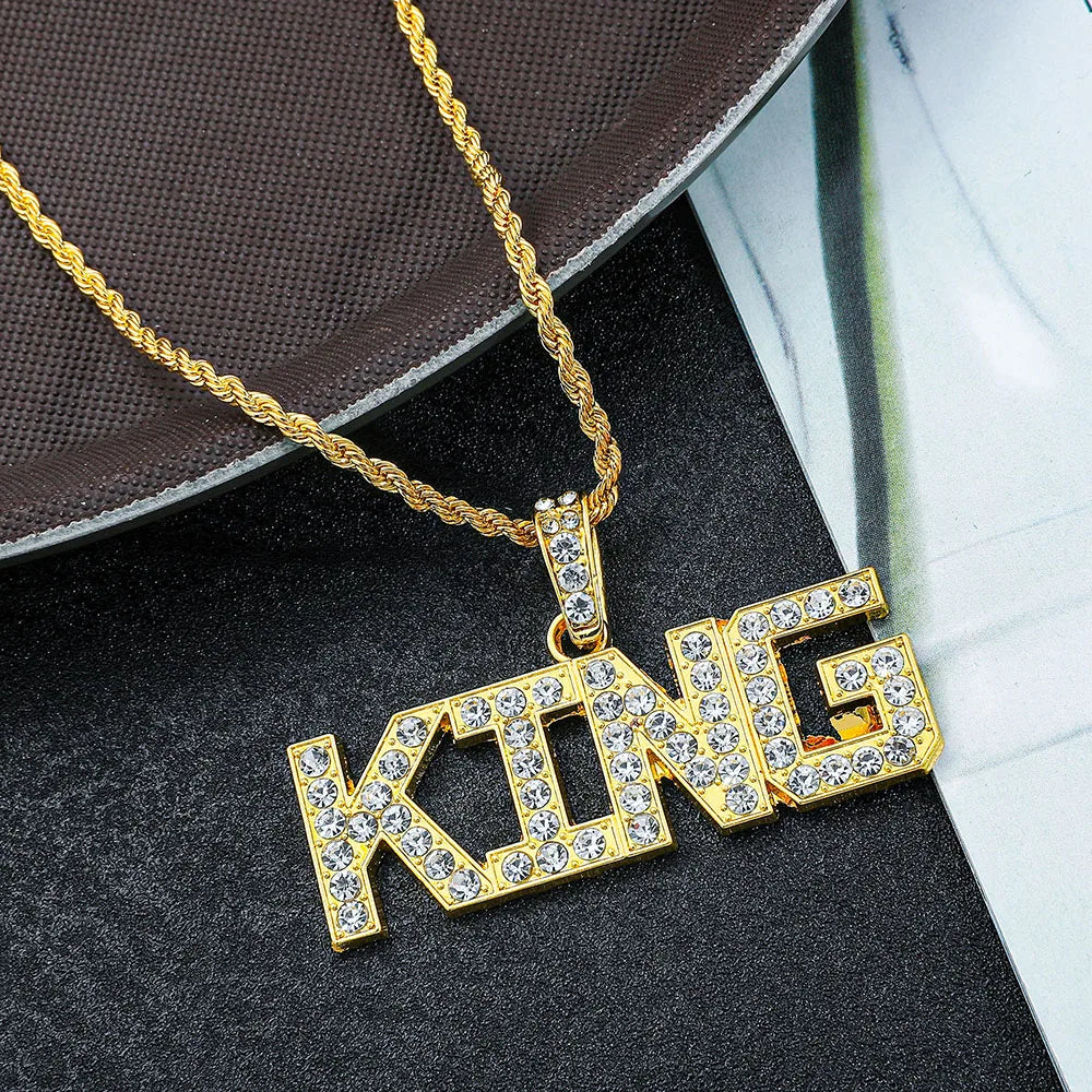 Gold-colored hip hop king pendant necklace with clear rhinestones on letters and twisted cuban link chain