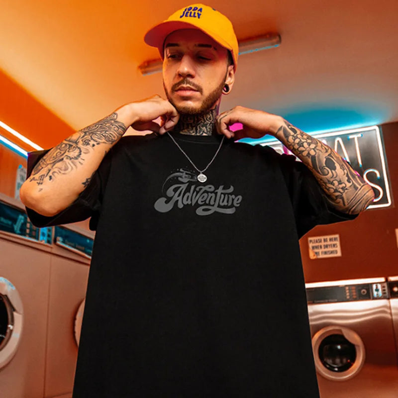 Men’s black oversized hip hop tshirt with gray adventure printing y2k streetwear graphic on short sleeve cotton fabric