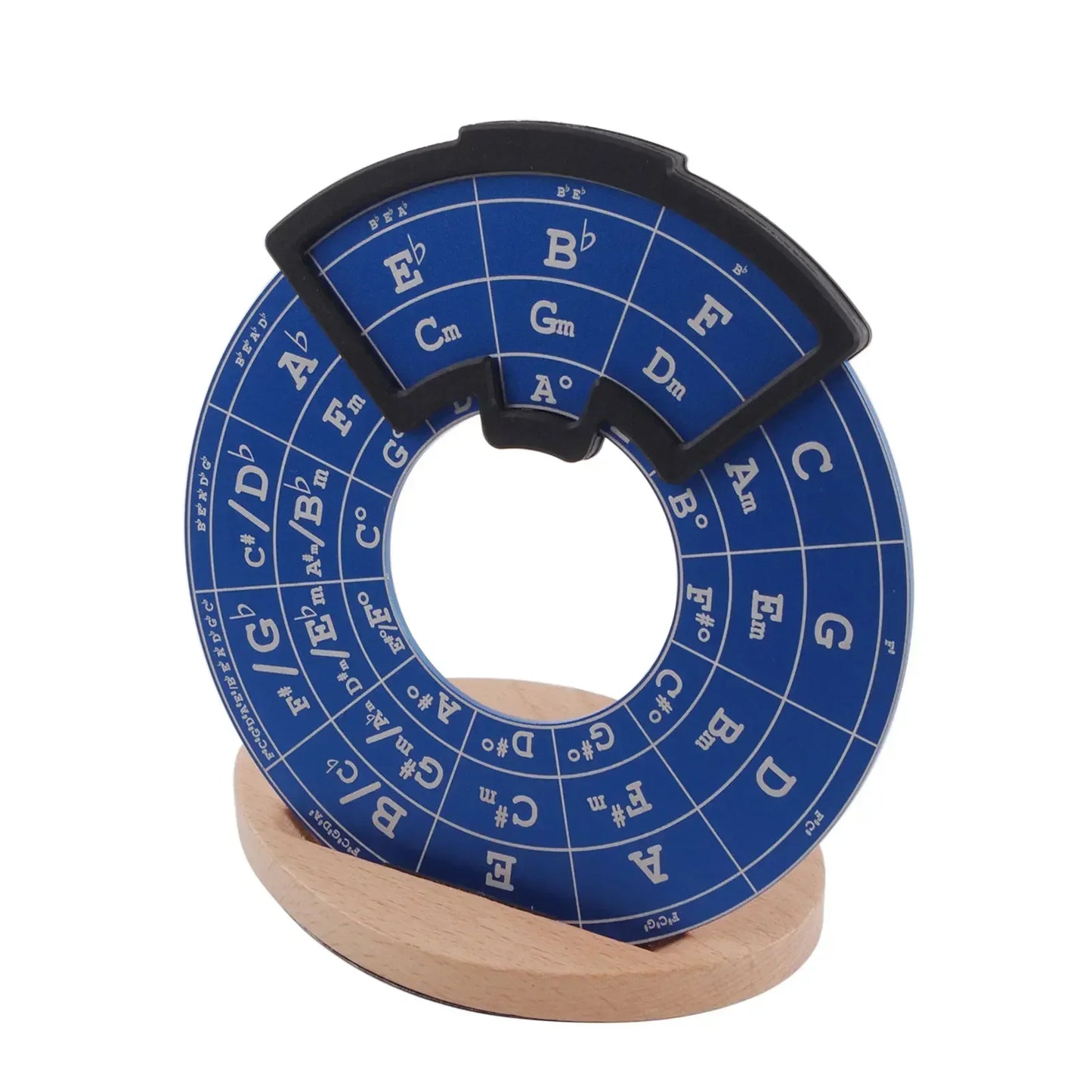 Blue circular metal fifths wheel with black tabs and white lettering on wooden stand music theory learning tool