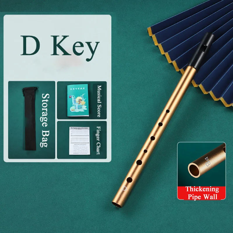 Golden d-key metal irish whistle with black mouthpiece and six finger holes for professional performance and student playing recorder