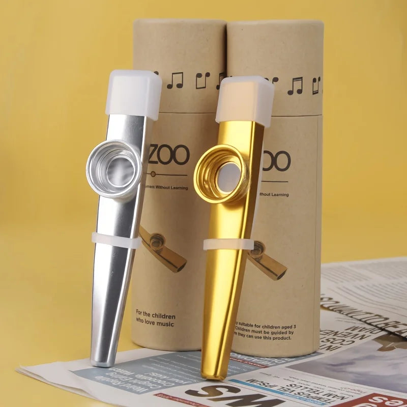 Two metal kazoo accompaniment toys in silver and gold with white mouthpieces for guitar ukulele beginner portable whistle use