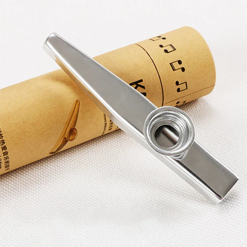 Shiny silver metal kazoo musical instrument with smooth polished finish and circular mouthpiece included in 5 pcs flute film gift set