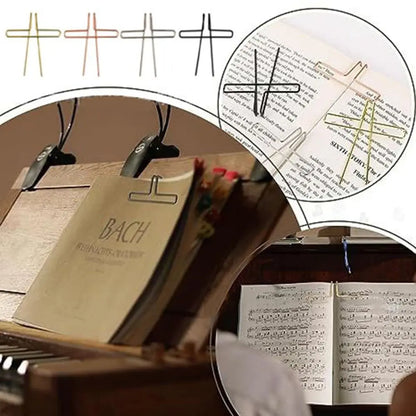 Clear plastic music sheet holder with black metal clip designed as page holder pianos and for cooking recipe magazines