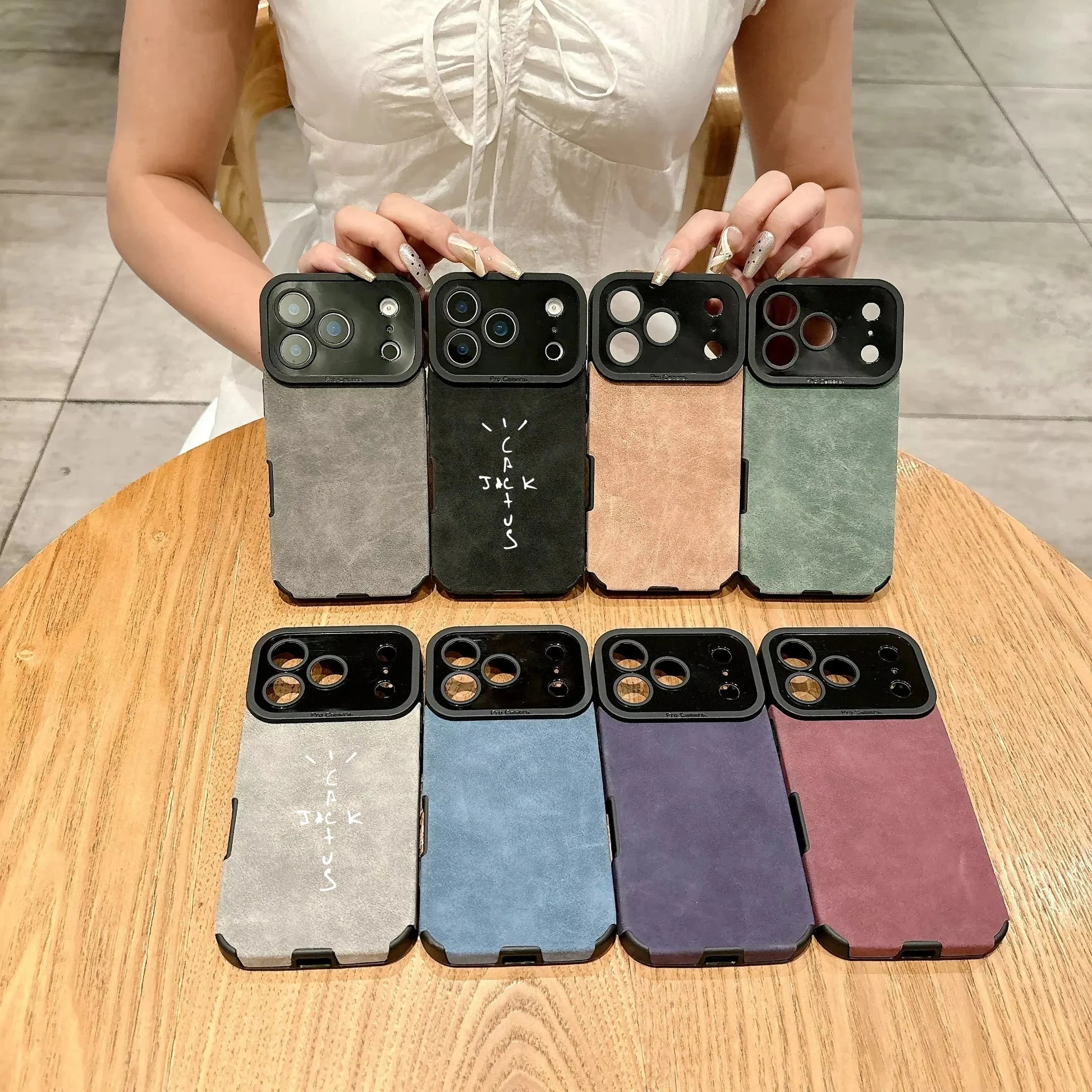 A collection of eight microfiber leather phone cases in muted tones with black cactus camera cutout for cover 16e luxury models