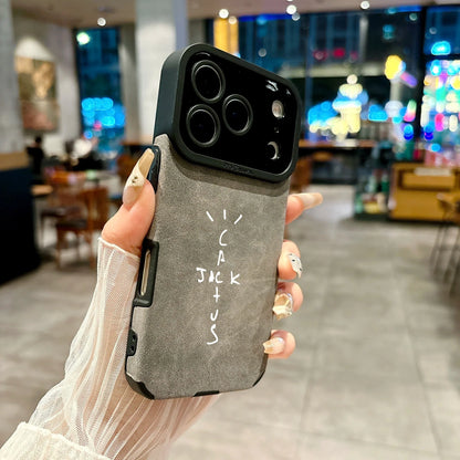 Back side of gray microfiber leather phone case with black camera bump and white cactus jack lettering for cover 16e luxury music jack cases