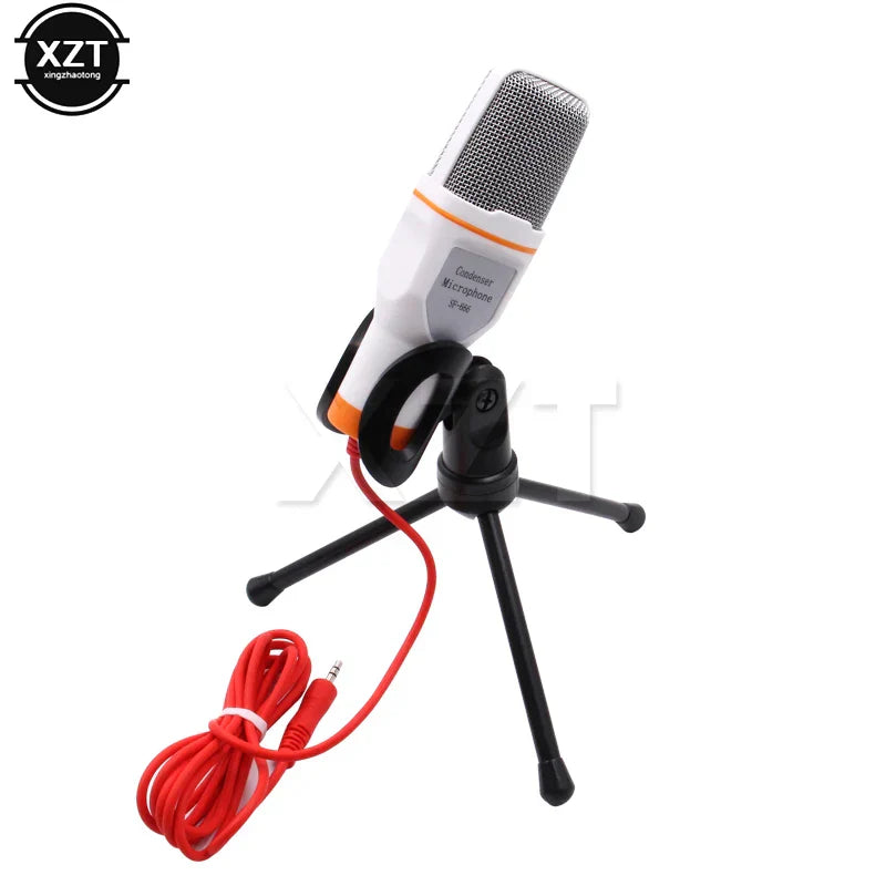 White and orange condenser microphone professional sound with silver mesh grille on black tripod stand for laptop skype singing