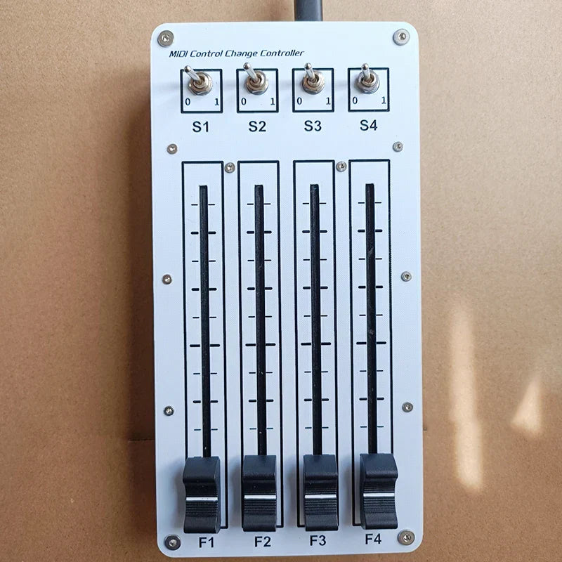 White midi cc controller with four black toggle switches and sliding fader usb for computer music hosting software