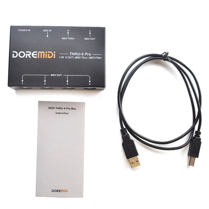 Black doremidi thru-6 pro midi filter box with labeled midi outputs and coiled usb cable for pc music production
