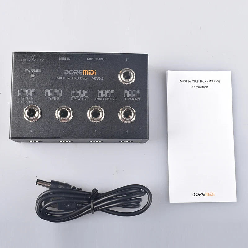 Black doremidi mtr-5 midi to trs box with multiple jacks and power cable to convert midi five-pin din interface