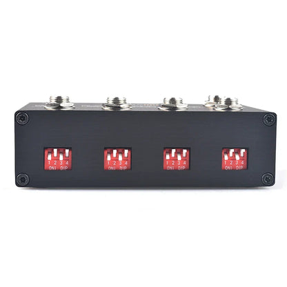 Black rectangular midi thru to trs box with four red toggle switches and silver connectors to convert midi five-pin din interface into trs outputs