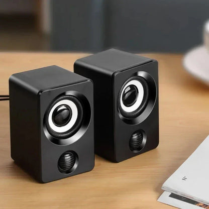 Black cube-shaped mini computer speaker usb wired with circular drivers and glossy finish for sound surround portable use