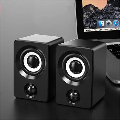 Black rectangular mini computer speaker with silver-rimmed drivers and glossy finish for usb wired sound surround portable use