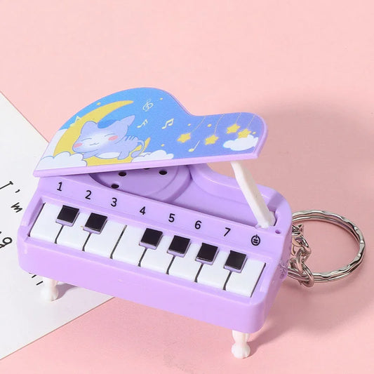 Purple plastic mini desktop piano keychain cute with cartoon cat lid and numbered keys educational toy easter gift