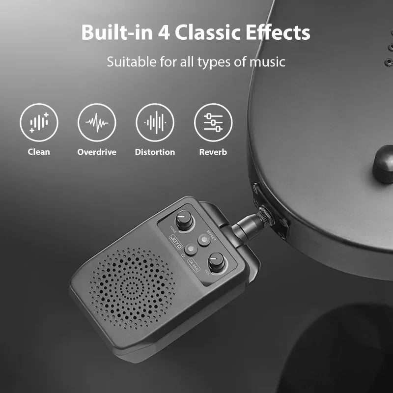 Black mini electric guitar speaker with four control knobs and built-in effects for portable practice use