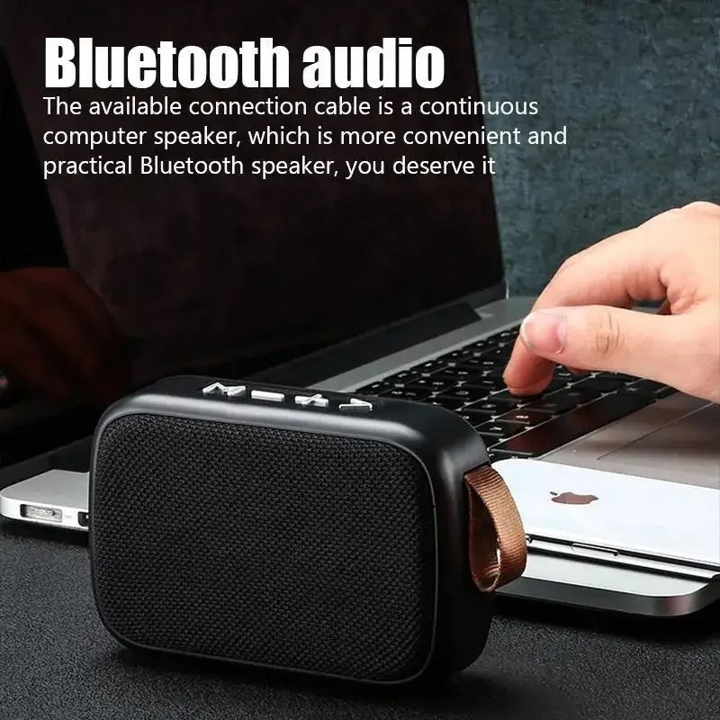 Black rectangular mini fabric speaker with textured grille and brown leather strap portable bluetooth 5.0 soundbar