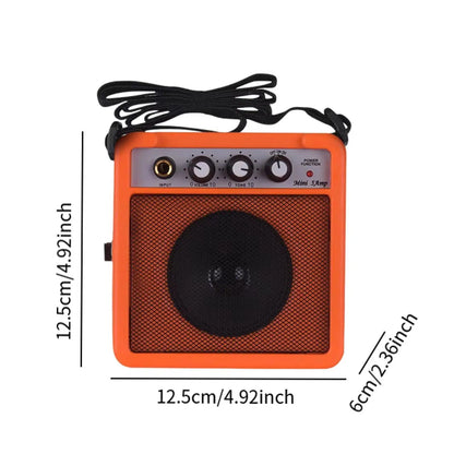 Orange mini guitar amplifier 5w small with black mesh grille and volume control for electric guitar from beat music store