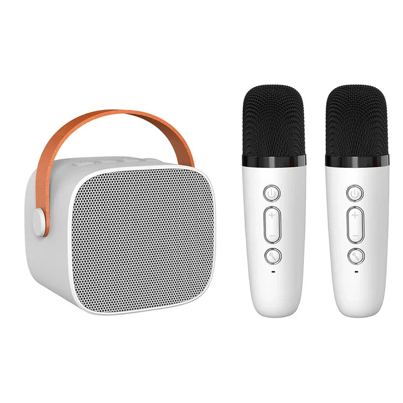 White kids portable speaker with orange leather handle and black mesh grille with two wireless microphones for karaoke machine