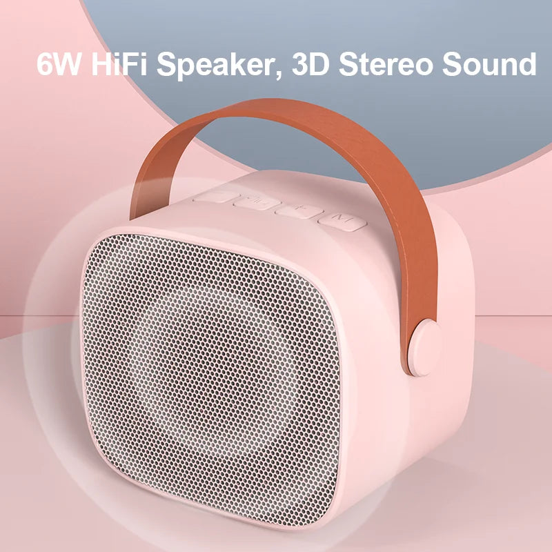 Pink kids portable speaker with brown leather handle and silver mesh grille for mini karaoke machine with wireless microphone