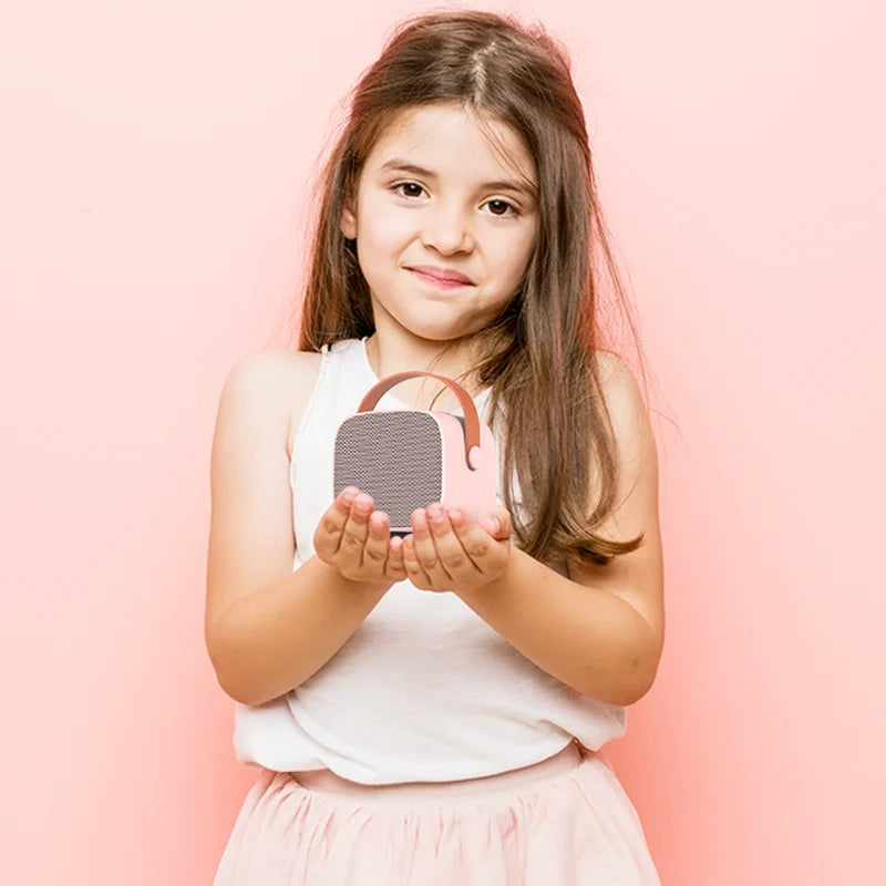Pink and gray kids portable speaker with brown leather handle mini karaoke machine with 1-2 wireless microphone for parties