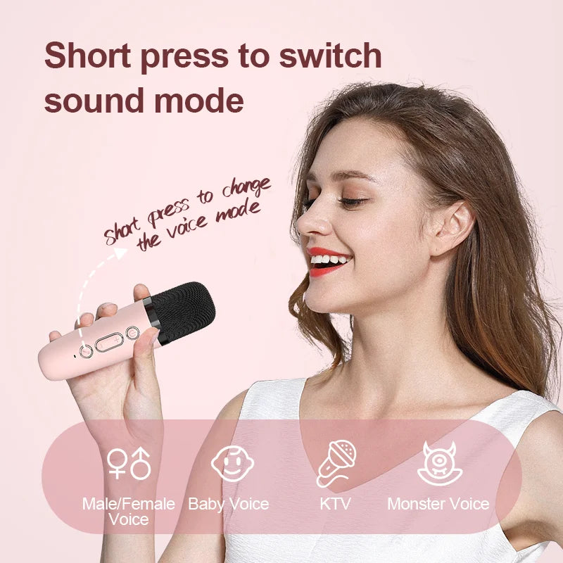 Pink handheld wireless microphone with black mesh grille and silver buttons for kids portable speaker karaoke machine