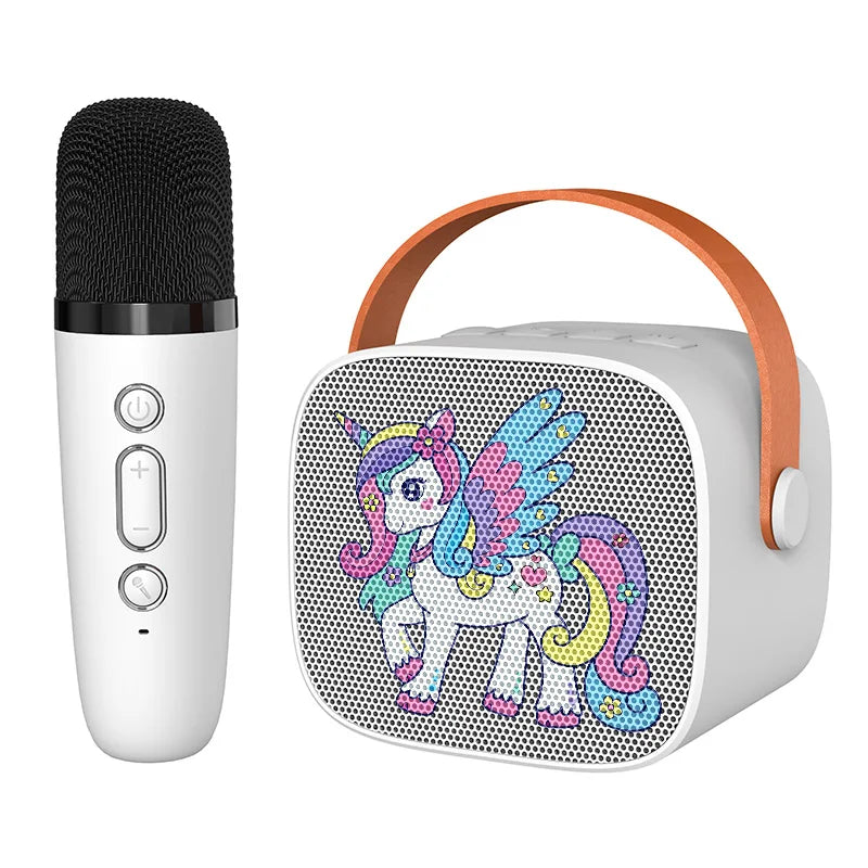 White kids portable speaker with colorful unicorn design and orange handle paired with white wireless microphone for karaoke machine