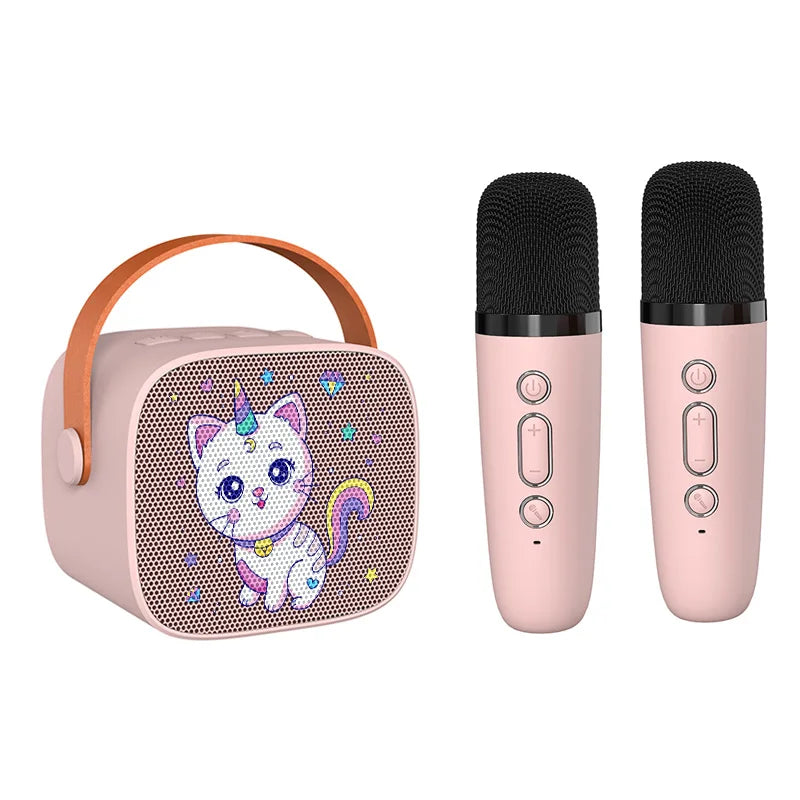 Pink unicorn-themed kids portable speaker with tan handle mesh front panel and wireless microphone for karaoke machine use