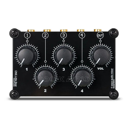 Black mini mc5 portable 4 channel audio mixer with gold-plated inputs and black rotary knobs for live studio console use