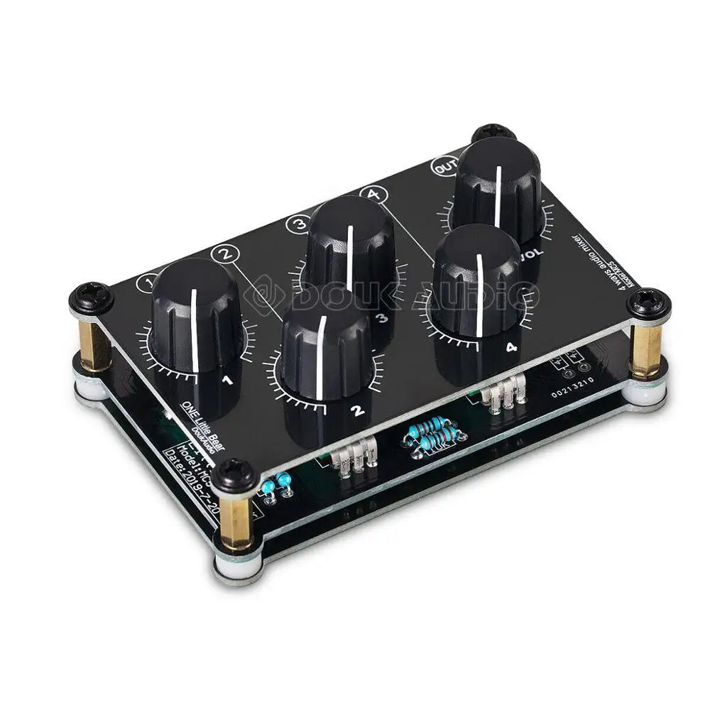 Black mini mc5 portable stereo 4 channel audio mixer with four black rotary knobs and gold-colored standoffs for live studio console use