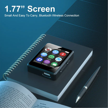 Black portable music player with 1.77-inch screen and usb-c port mp4 player bluetooth resting on spiral notebook