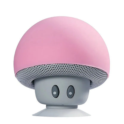 Pink mini mushroom wireless speaker with gray stem perforated cap mic portable waterproof shower stereo subwoofer