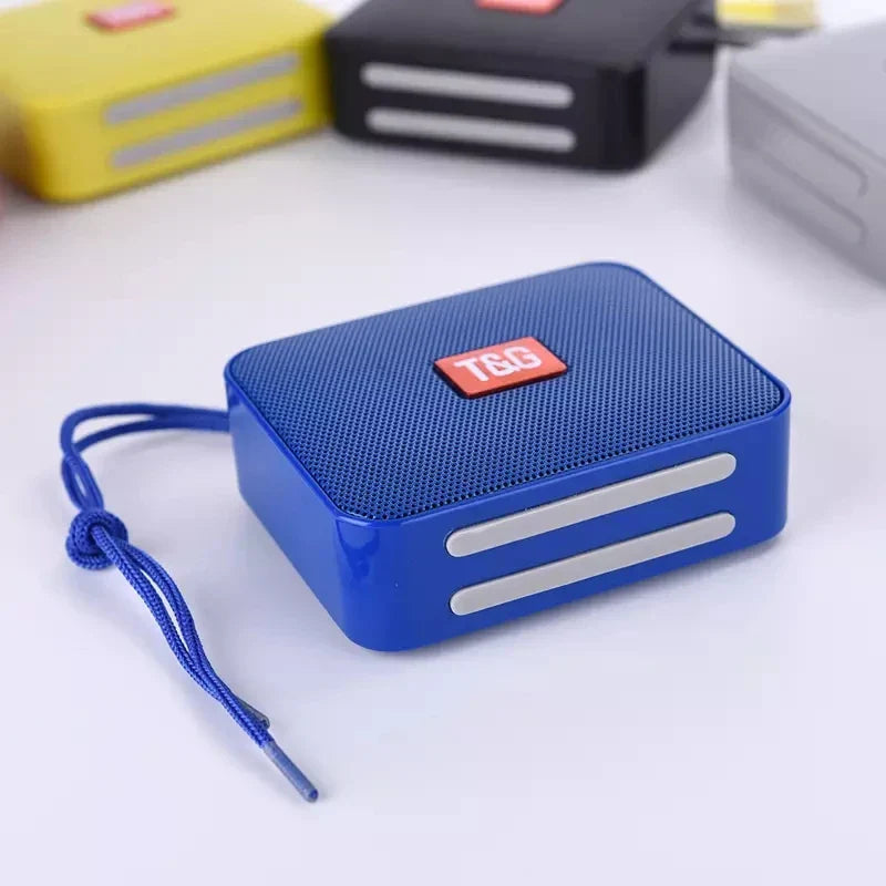 Blue rectangular portable outdoor riding column 5w boombox with textured grille and red t&g logo patch hiking music player