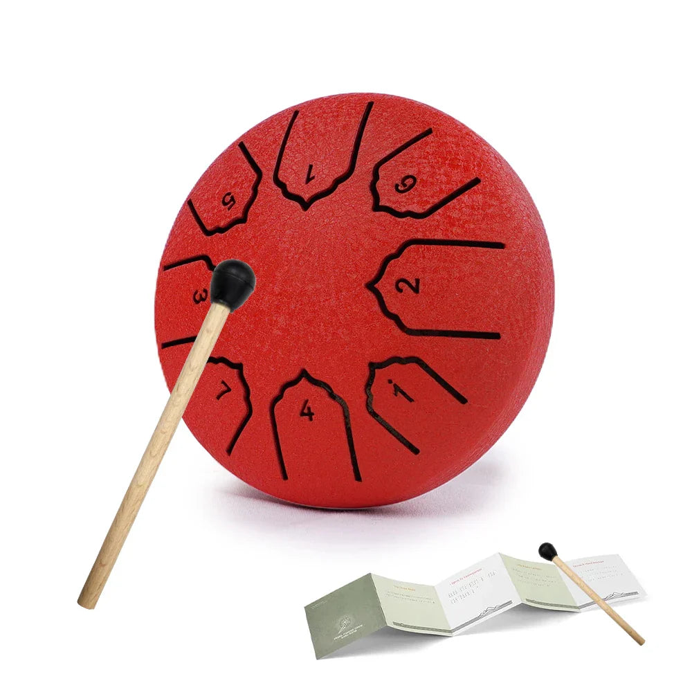 Red tenor steel tongue drum with black number markings and wooden mallet for outdoor notes rain drum and drum rain chime use