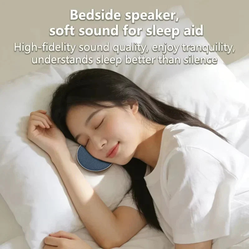 Blue circular mini under pillow sleep speaker with dynamic sound wireless technology for home sleep sound equipment