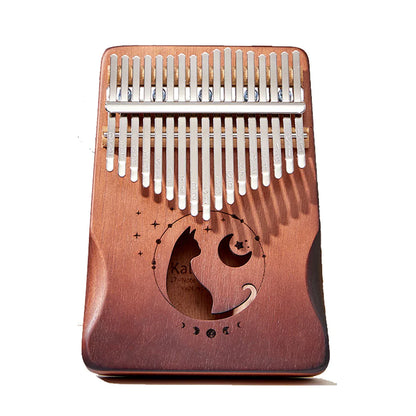 A mahogany wood miwayer cat kalimba thumb piano with silver keys and engraved cat and moon design for beginners