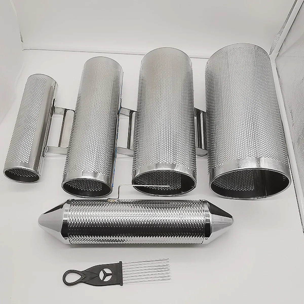 Set of four chrome-finished miwayer guira stainless percussion guiro instruments with textured surfaces and tuning tool