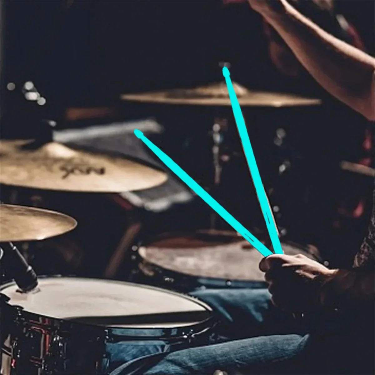 A pair of teal miwayer luminous drum stick light glowing in hand for instruments stage performance in the dark