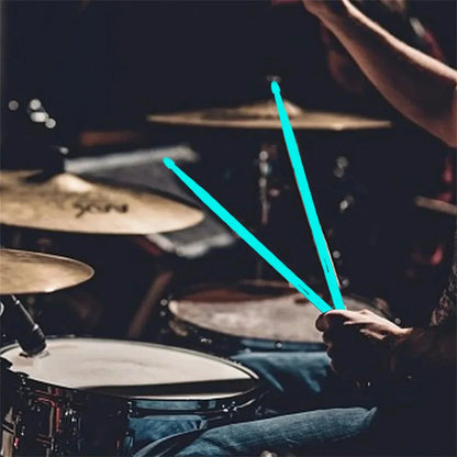 A pair of teal miwayer luminous drum stick light glowing in hand for instruments stage performance in the dark