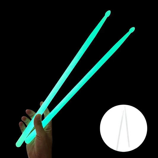 A pair of miwayer luminous drum stick light in glowing green with smooth surface for dark musical instruments use