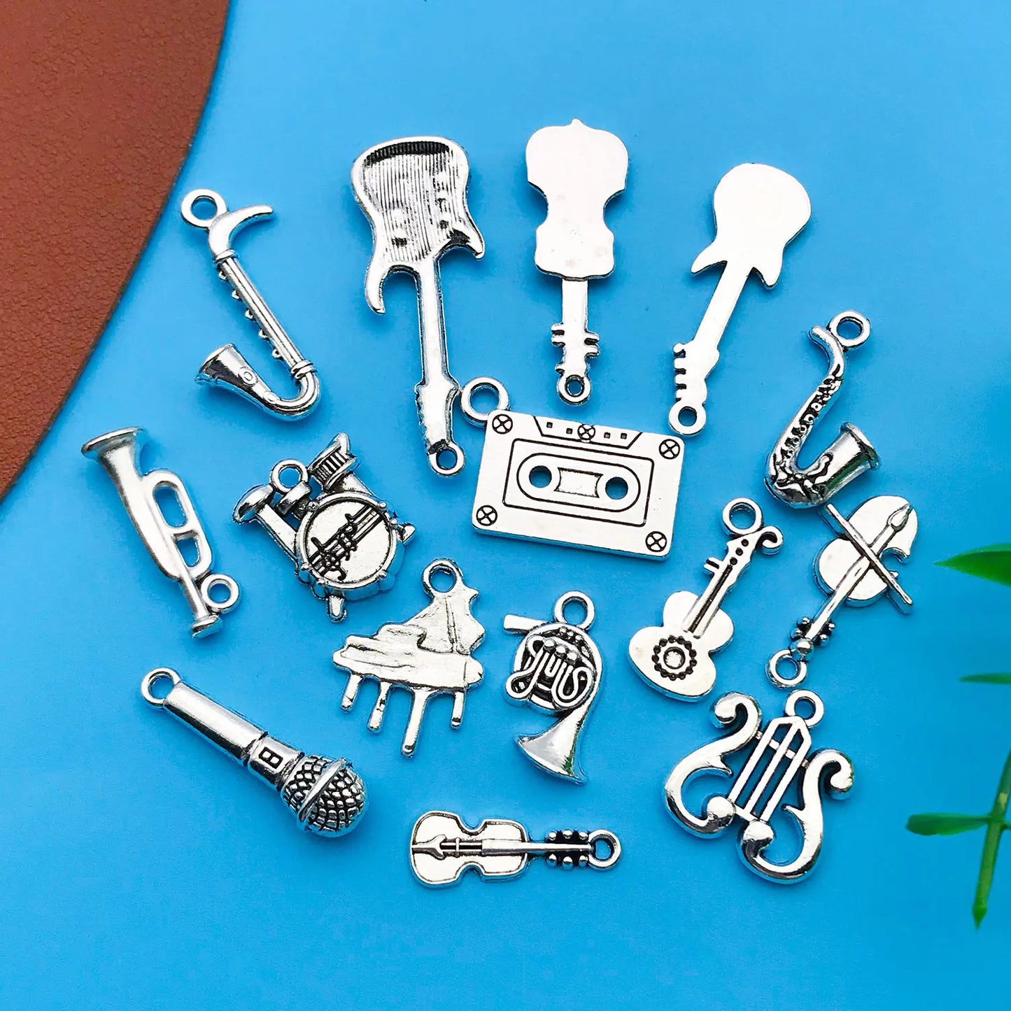 Silver-toned mix 15pcs antique musical instrument charms featuring guitar piano violin designs for jewelry making