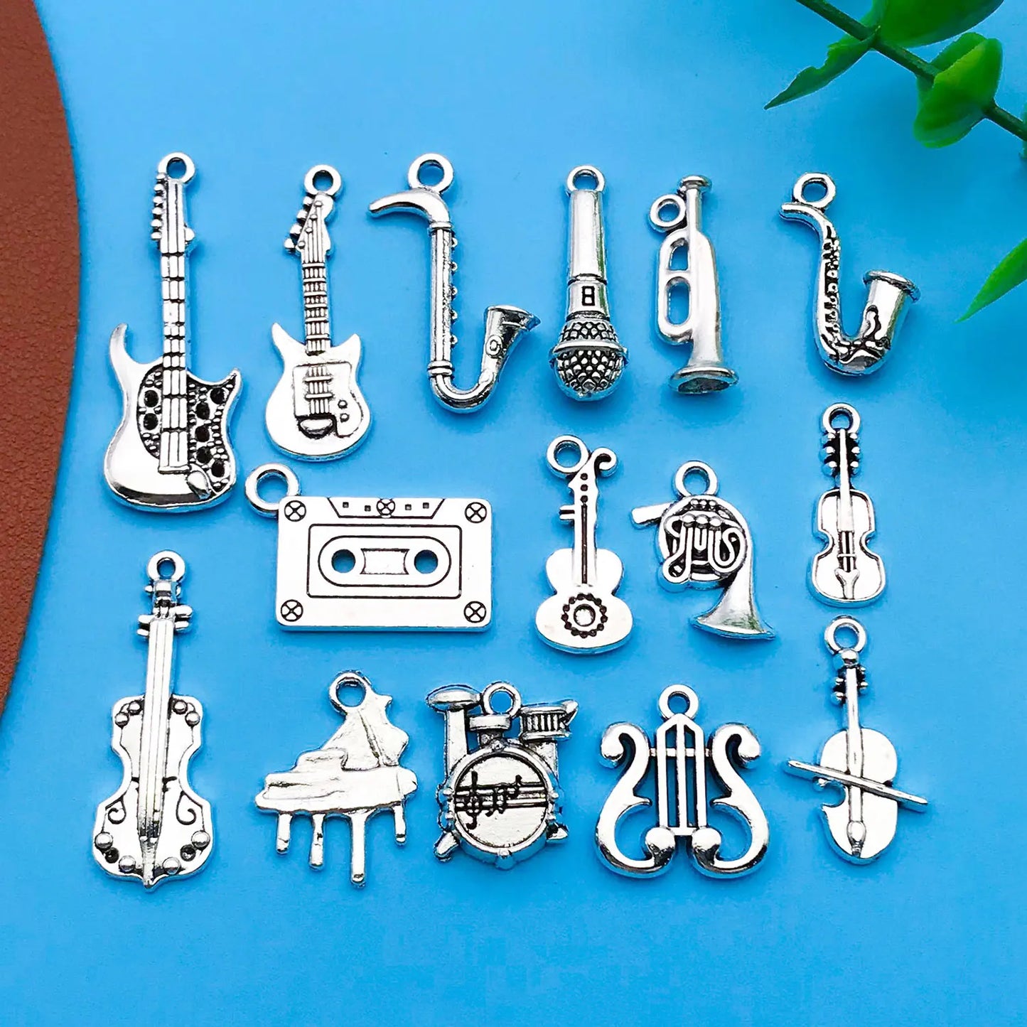 Silver-toned mix 15pcs antique musical instrument charms featuring guitar piano violin designs for jewelry making