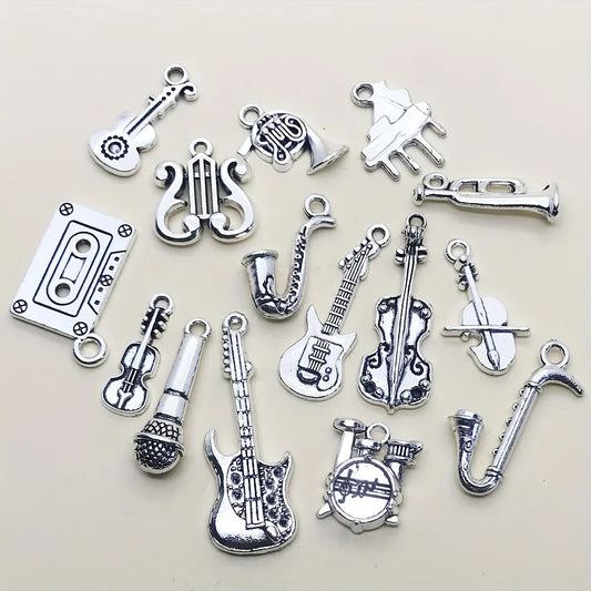 Silver-toned antique silvery musical instrument charms featuring detailed guitars saxophones violins and cassette tape for jewelry making guitar piano violin music crafts