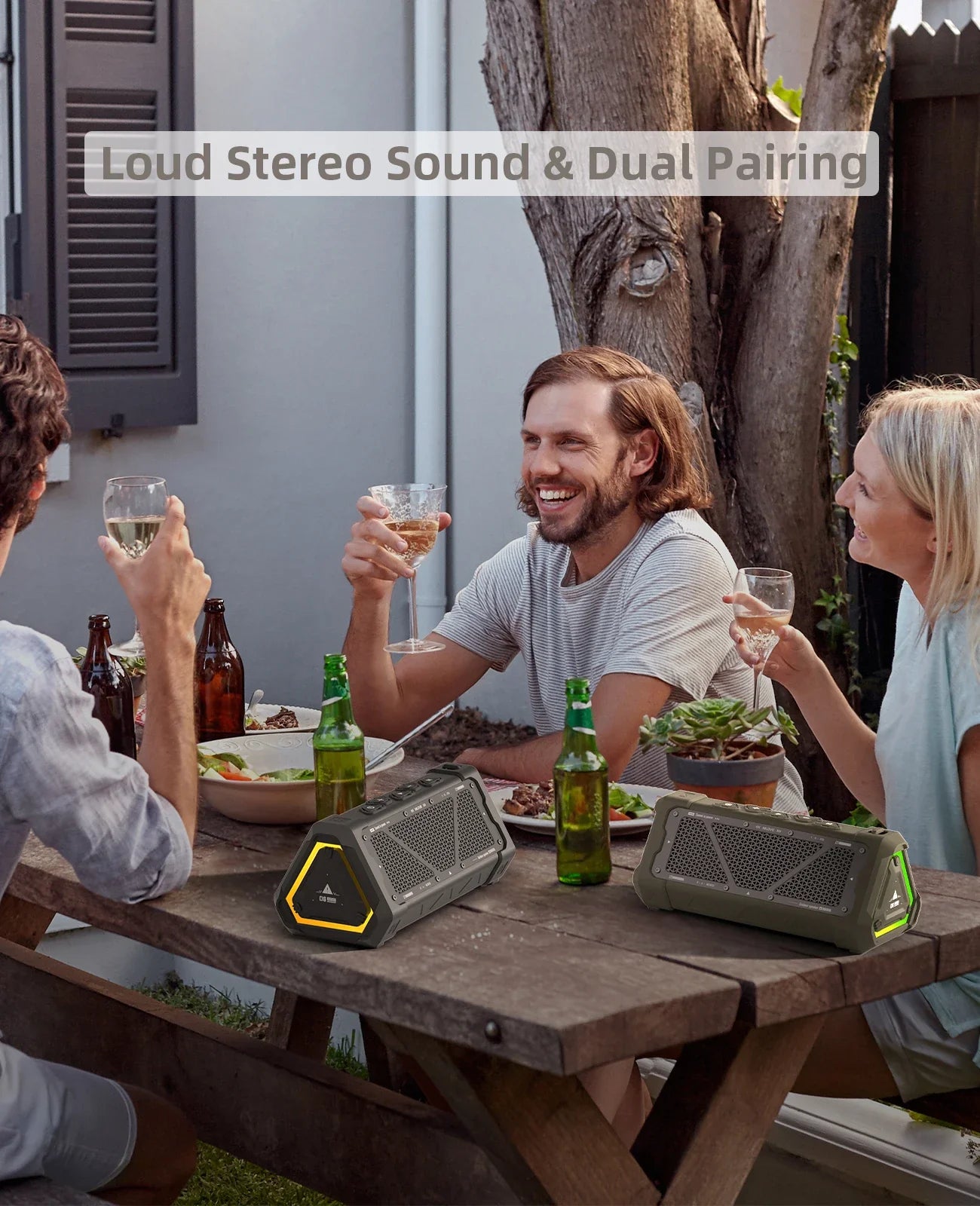 Two rugged olive green mlove p3 bluetooth speakers with yellow trim on wood table featuring micro sd card slot and long battery life