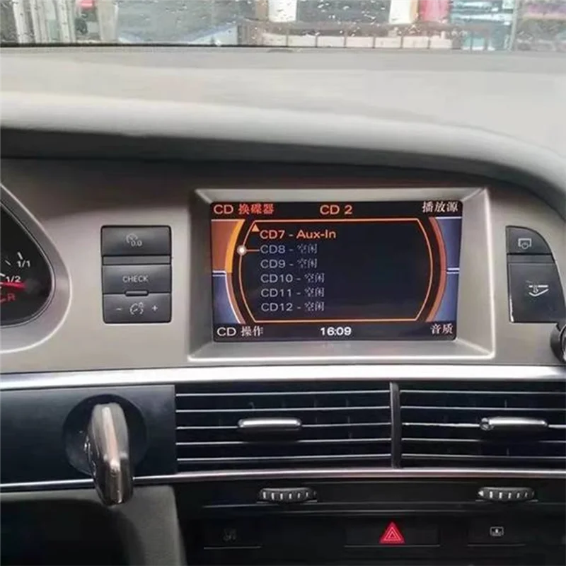 Silver-framed car infotainment screen displaying cd player menu in chinese with mmi 2g bluetooth music adapter for audi a6l