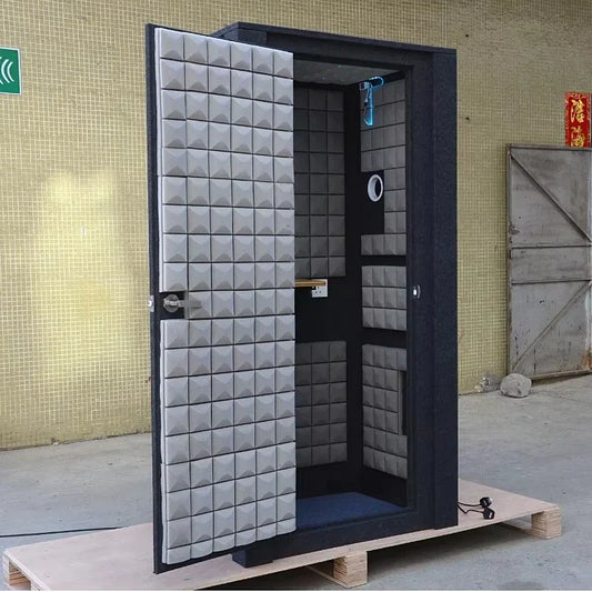 Gray acoustic treatment booth with black frame and pyramid panels for mobile portable home office music studio recording